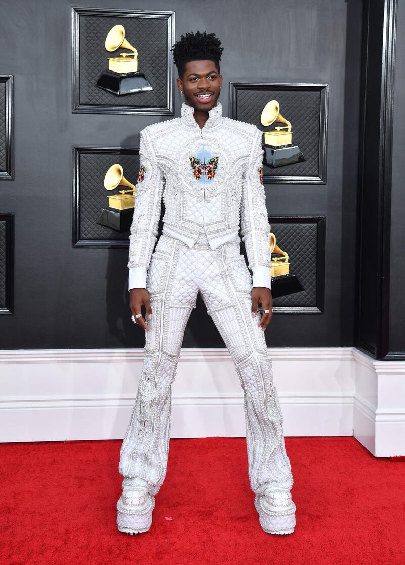 Lil Nas X, wearing an embellished suit, at the Grammy Awards on April 3, 2022. AFP