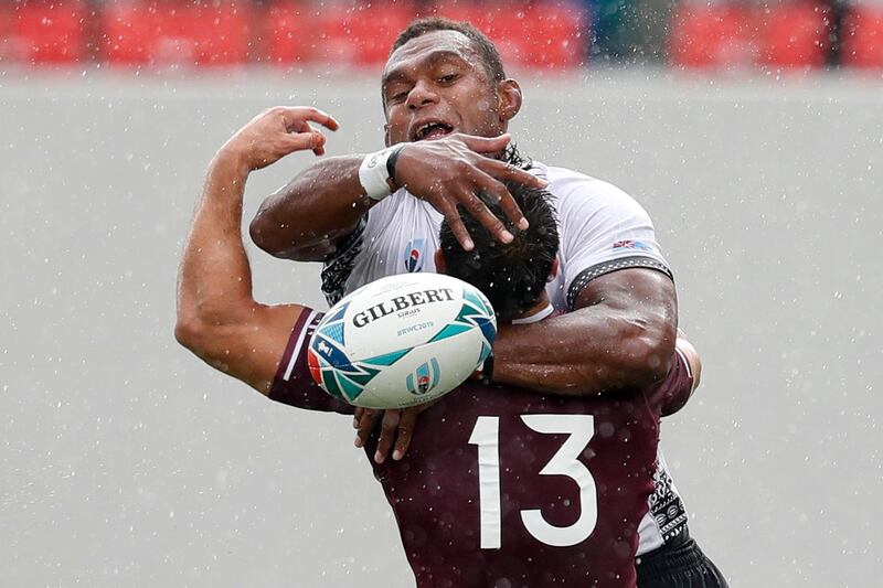Fiji's Leone Nakarawa battles for possession with Davit Kacharava of Georgia, during their Rugby World Cup clash on Tuesday, October 1. Reuters