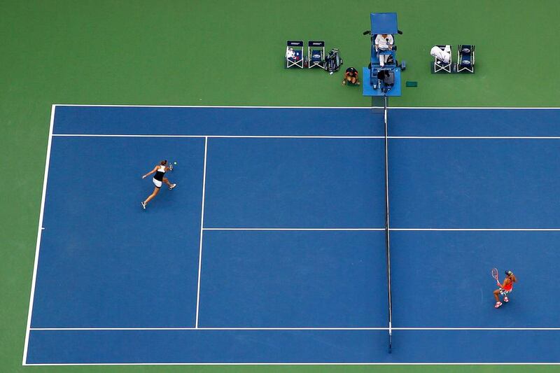 Karolina Pliskova, left, returns a shot to Angelique Kerber. Al Bello / Getty Images