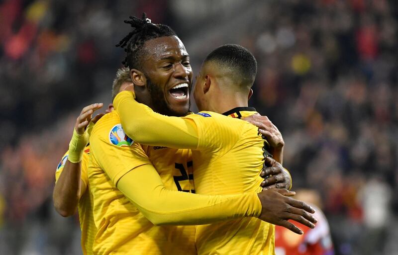 Belgium's Youri Tielemans, right, celebrates with Belgium's Michy Batshuayi, left, after scoring his sides first goal. AP Photo