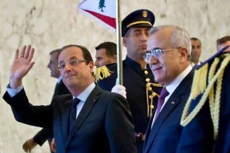 French president Francois Hollande, left, told his Lebanese counterpart, Michel Sleiman,  that France will ‘oppose with all its strength any bid to destabilise Lebanon’.