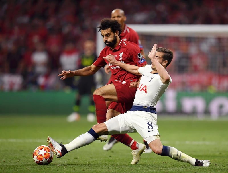 Salah rides a challenge from Tottenham's Harry Winks. Getty