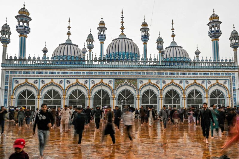 Worshippers leave Jamia Mosque in Rawalpindi, central-eastern Pakistan, after offering the first Friday prayers of the holy month. AFP