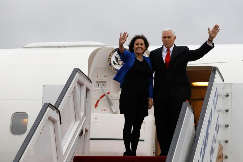 U.S. Vice President Mike Pence and his wife Karen wave as they board an airplane ahead of their departure from Ben Gurion International Airport, in Lod, near Tel Aviv, Israel, Tuesday, Jan. 23, 2018. (Ronen Zvulun/Pool photo via AP)