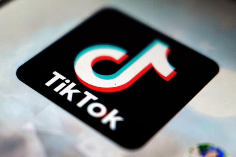 FILE - In this Sept. 28, 2020 file photo, a view of the TikTok app logo, in Tokyo.  Social media and other internet companies face big fines in Britain if they don't limit the amount of harmful material such as child sexual abuse or terrorist content on their platforms, officials said Tuesday, Dec. 15, 2020. (AP Photo/Kiichiro Sato, File)