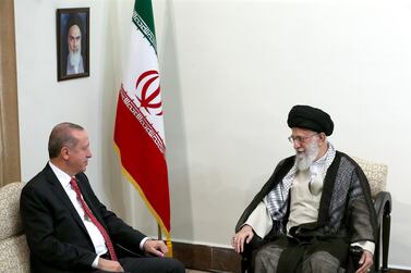 Iran's Ayatollah Ali Khamenei, right, with Turkey's Recep Tayyip Erdogan are pursuing deeply ideological projects in the Middle East. AP Photo