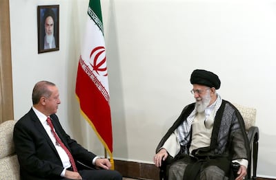 In this photo released by an official website of the office of the Iranian supreme leader, Supreme Leader Ayatollah Ali Khamenei, right, meets with Turkish President Recep Tayyip Erdogan, in Tehran, Iran, Wednesday, Oct. 4, 2017. (Office of the Iranian Supreme Leader via AP)