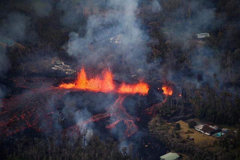 Activity continues as a fissure eruption fountains more than 100 feet into the air near Pahoa, Hawaii, US, on May 6, 2018. Bruce Omori / Paradise Helicopters / EPA