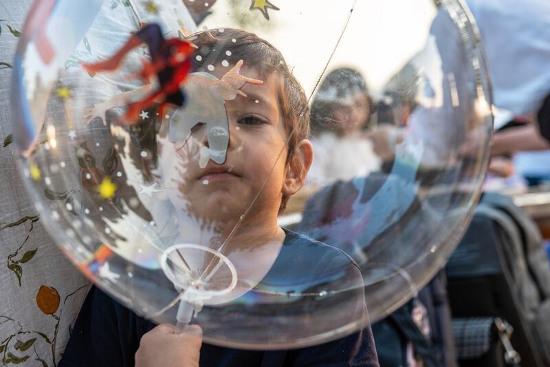 A child plays with a balloon during Christmas celebrations of the Ukrainian community in Abu Dhabi. All photos: Vidhyaa Chandramohan / The National.