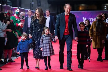Britain's Prince William and Kate, the Duke and Duchess of Cambridge and their children, Prince Louis, left, Princess Charlotte and Prince George. AP