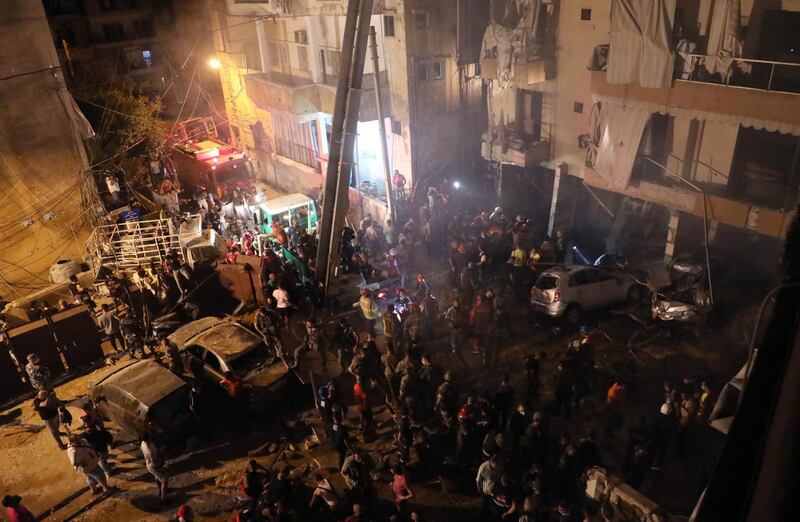 Rescuers work at the site of a fuel tank explosion in the al-Tariq al-Jadida neighborhood of Beirut, Lebanon. REUTERS