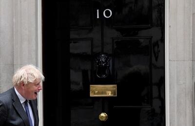 FILE PHOTO: Britain's Prime Minister Boris Johnson reacts in front of 10 at Downing Street, in London, Britain June 17, 2021. REUTERS/Toby Melville/File Photo
