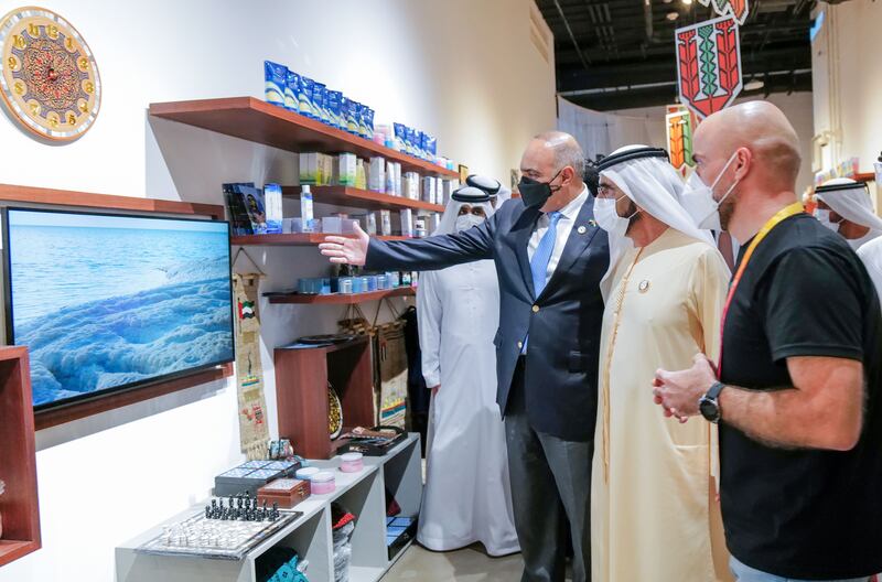 Mr Al Khasawneh gives Sheikh Mohammed a tour of the Jordan pavilion's exhibits.