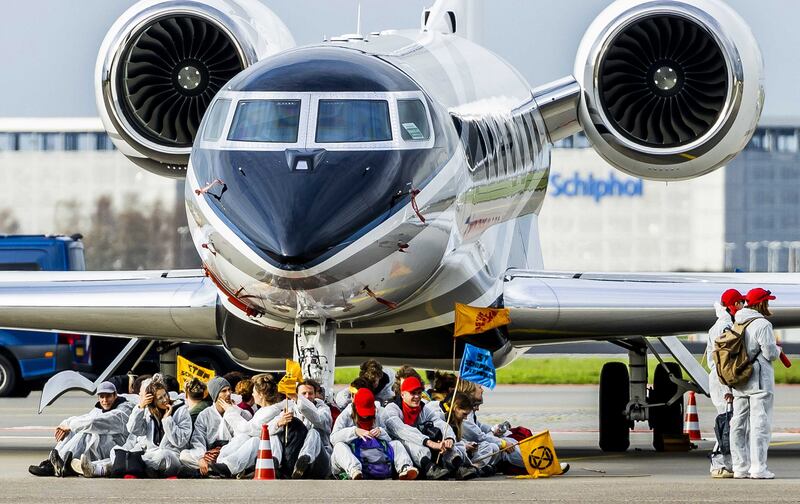 Members of environmental organisations during the protest action 'SOS for the climate' at Schiphol Airport in the Netherlands. Milieudefensie, Extinction Rebellion and Greenpeace, among others, joined the protest. EPA