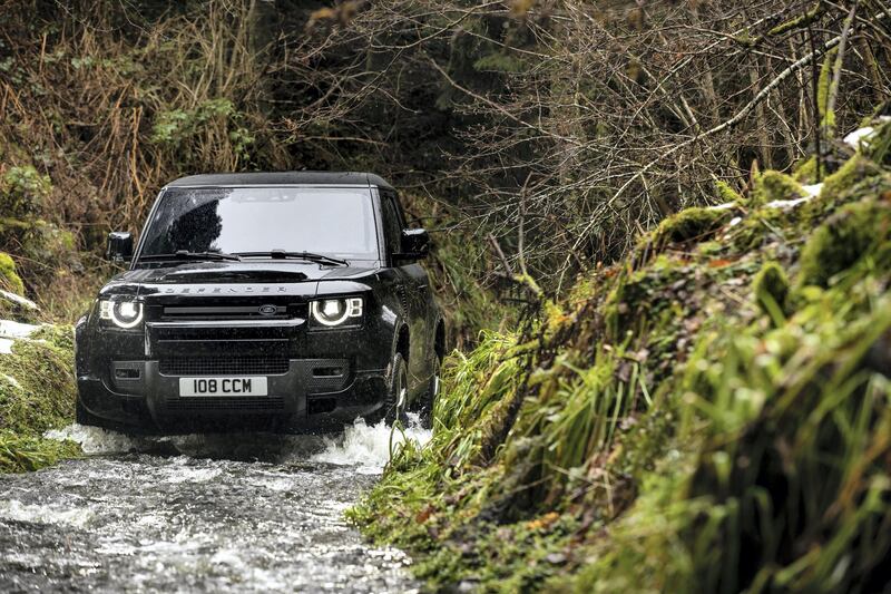 A Defender V8 tackles a soggy hazard.