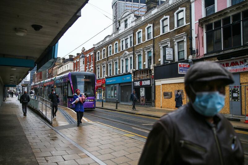 Pedestrians walk past boarded up shops on George Street in Croydon, south London, U.K., on Monday, Feb. 22, 2021. Saddled with commercial properties battered by the pandemic, some of the world’s biggest investors are making a wager: apartment living will make more of a post-Covid comeback than in-person retail. Photographer: Hollie Adams/Bloomberg