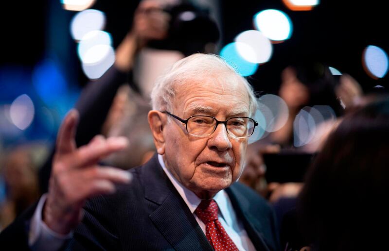 (FILES) In this file photo taken on May 4, 2019, Warren Buffett, CEO of Berkshire Hathaway, speaks to the press as he arrives at the 2019 annual shareholders meeting in Omaha, Nebraska. Hard-hit by the market rout surrounding the coronavirus pandemic, Berkshire Hathaway has reported first-quarter net losses of nearly $50 billion, it reported on May 2, 2020.

 / AFP / Johannes EISELE
