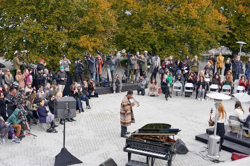 Musician Jon Batiste performs at a press preview of the exhibition. AP