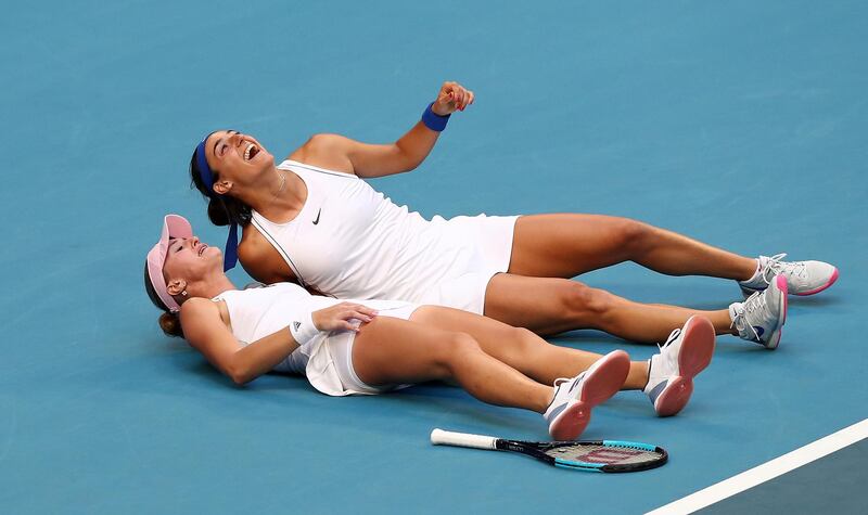 epa07985598 Caroline Garcia and Kristina Mladenovic of France celebrate winning the doubles match against Ash Barty and Sam Stosur of Australia on day 2 of the Fed Cup Final tennis competition between Australia and France at RAC Arena in Perth, Australia, 10 November 2019.  EPA/GARY DAY EDITORIAL USE ONLY AUSTRALIA AND NEW ZEALAND OUT