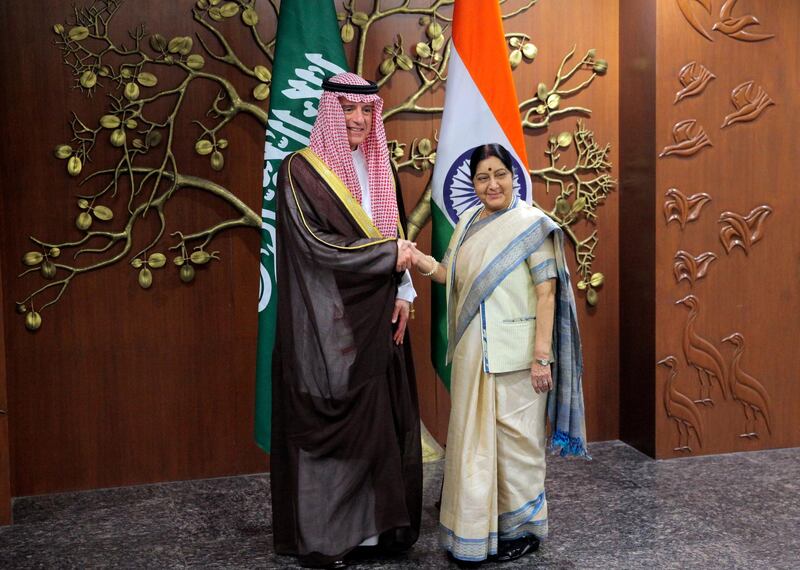 Indian Foreign Minister Sushma Swaraj, right, shakes hand with her Saudi Arabia counterpart Adel al-Jubeir before their delegation level meeting in New Delhi, India, Monday, March 11, 2019. (AP Photo/Shonal Ganguly)
