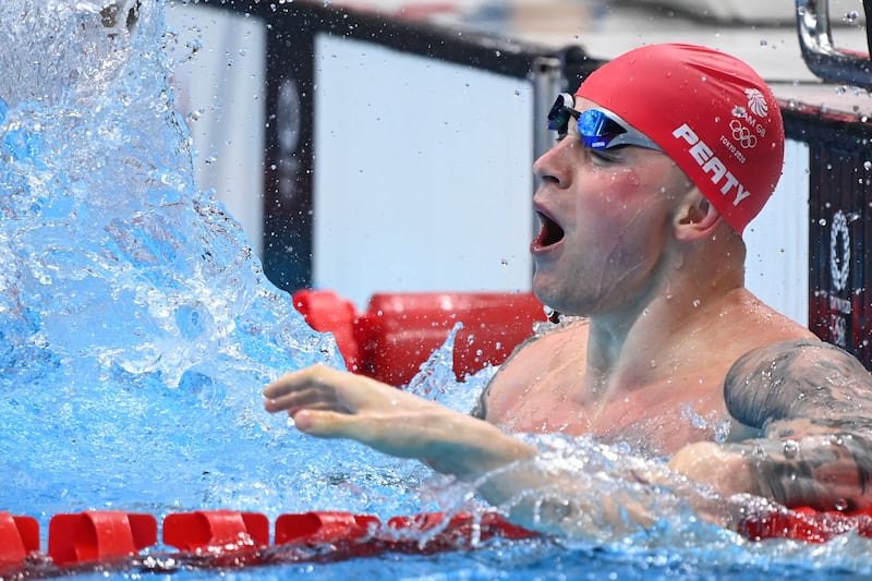 Britain's Adam Peaty celebrates gold in the 100m breaststroke in Tokyo.