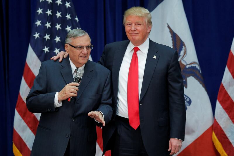 FILE PHOTO: U.S. Republican presidential candidate Donald Trump is joined onstage by Maricopa County Sheriff Joe Arpaio (L) at a campaign rally in Marshalltown, Iowa January 26, 2016, after Arpaio endorsed Trump's cacndidacy.  REUTERS/Brian Snyder/File Photo