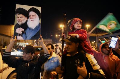 Iraqi supporters of Sadr's movement celebrate after Iraq's Supreme Court ratified the results of parliamentary election, in Najaf, on December 27. Reuters