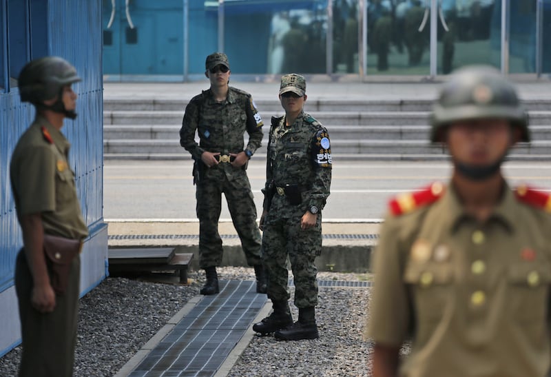 South Korean soldiers inspect and their North Korean counterparts during a reunification rally in the border village of Panmunjom at the DMZ in North Korea, in 2015.