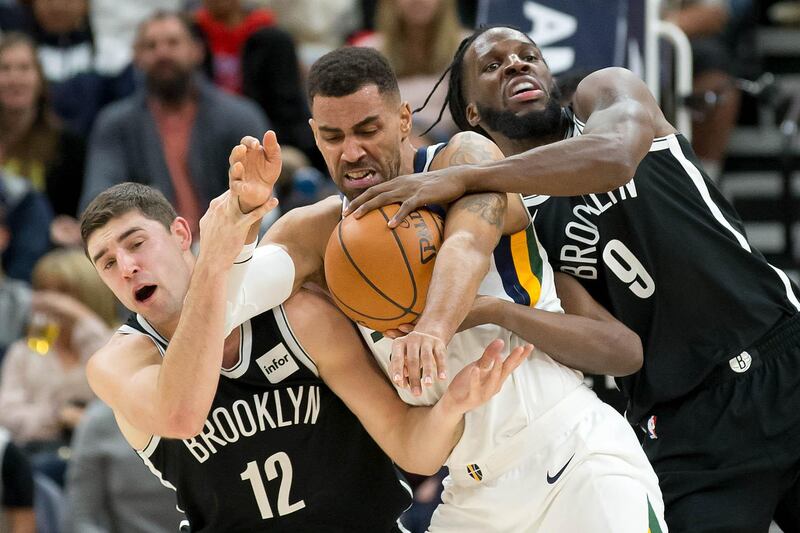 Brooklyn Nets guard Joe Harris and forward DeMarre Carroll and Utah Jazz forward Thabo Sefolosha battle for the ball during the second half at Vivint Smart Home Arena. Russ Isabella / USA TODAY Sports