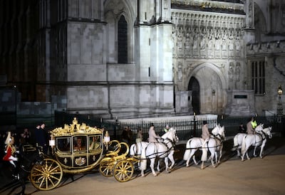 The Diamond Jubilee Coach is ridden alongside members of the military during a full overnight dress rehearsal of the coronation ceremony. Reuters 