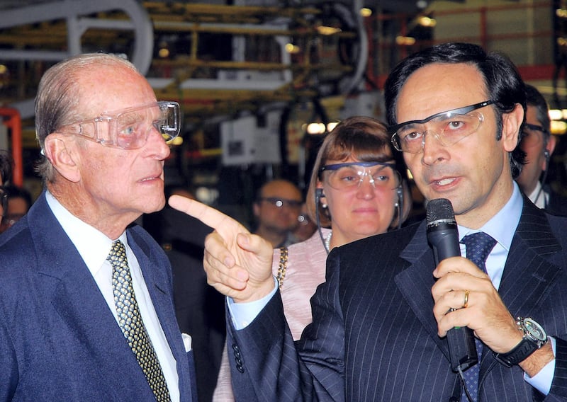 The duke of Edinburgh, Prince Phlilip (L), visits the Tofas car factory in Bursa, on May 14, 2008 with Tofas industrial group director Massimo Rissi. Britain's Queen Elizabeth II and her husband Prince Philip visited historic sites and listened to verses from the Koran on May 14, 2008 in the northwestern city of Bursa on the second day of her four-day state visit to Turkey.
 AFP PHOTO/ANATOLIA NEWS AGENCY/POOL (Photo by - / POOL / AFP)