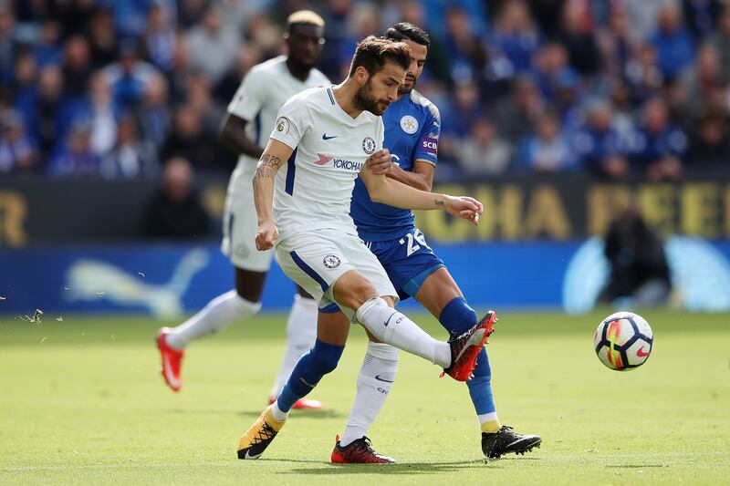 Chelsea midfielder Cesc Fabregas in action against Leicester City winger Riyad Mahrez. Clive Mason / Getty Images