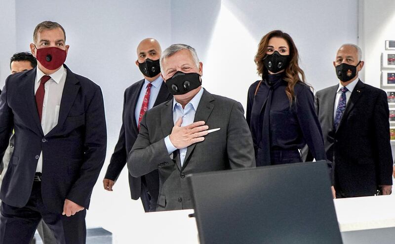 Jordanian King Abdullah II (C-L) accompanied by his wife Queen Rania (C-R), as they and their entourage are clad in masks due to the COVID-19 coronavirus pandemic, while inaugurating a new emergency hospital in the capital Amman. AFP