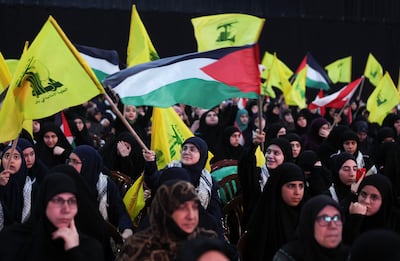 Hezbollah supporters wave flags as they wait for leader Hassan Nasrallah to speak this week. The LF and Hezbollah are staunch opponents. Reuters