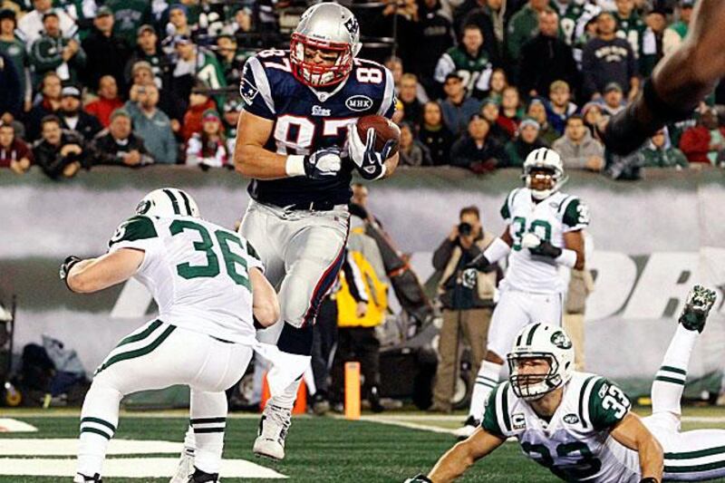 Rob Gronkowski, the New England tight end, catches a touchdown pass during the Patriots 371-6 rout of the New York Jets.