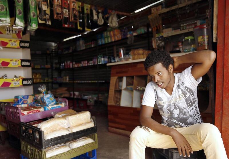 Convenience stor owner Daniel Waza, here inside his shop in Nkaneng township, counts among his customers the striking platinum miners. Siphiwe Sibeko / Reuters