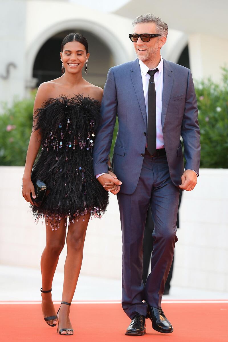 Vincent Cassel and his wife, Tina Kunakey, arrive for the screening of 'J'Accuse' on August 30, 2019 during the Venice Film Festival. AFP