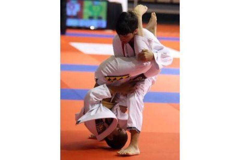 Children get to grips with the sport during the jiu-jitsu tournament in Abu Dhabi in April.
