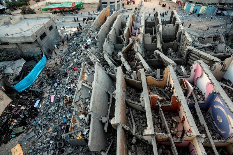 A picture taken  shows the remains of a building in Gaza City after it was hit during Israeli air strikes.  AFP