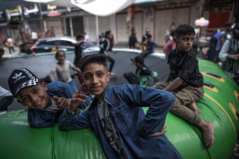 Palestinians enjoy their time on the first day of Eid Al Fitr in Jabalia refugee camp in the northern Gaza Strip. Getty Images