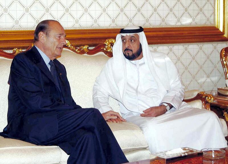 A handout picture released by the United Arab Emirates' official news agency WAM shows French President Jacques Chirac meeting with Emirati President Sheikh Khalifa bin Zayed al-Nahayan in Abu Dhabi 05 November 2004. Chirac arrived in Abu Dhabi to offer condolences on the death of United Arab Emirates President Sheikh Zayed bin Sultan al-Nahayan, a diplomatic source said. He met Sheikh Khalifa, the late president's eldest son who succeeded him as head of state.      AFP PHOTO/HO-WAM (Photo by WAM / AFP)