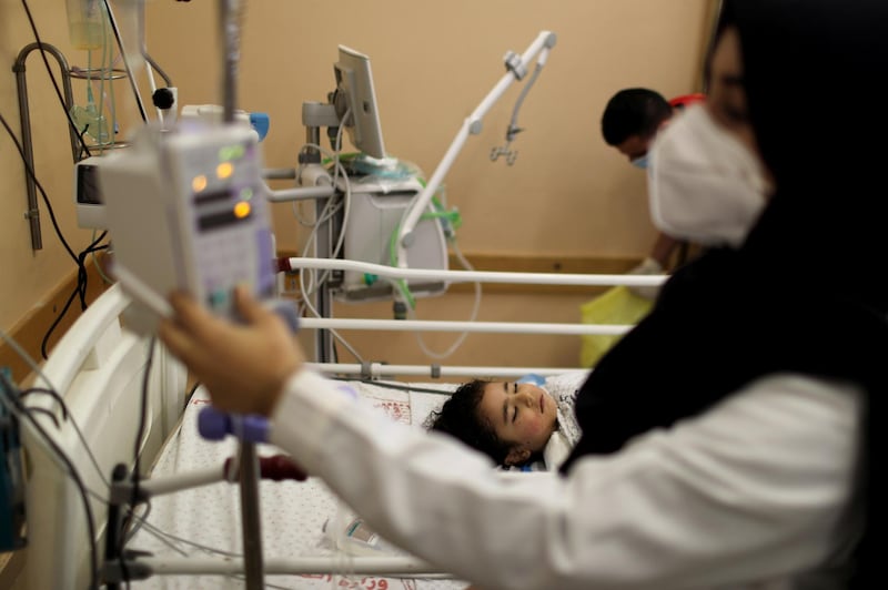 Wounded Palestinian girl Sara Al-Metrabeeay lies on a bed in Shifa Hospital in Gaza city. Reuters