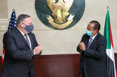 A handout picture provided by Sudan's Prime Ministers office on August 25, 2020, shows US Secretary of State Mike Pompeo (L) greeting Sudanese Prime Minister Abdalla Hamdok (R) in Khartoum. Pompeo is on an official visit to Sudan to urge more Arab countries to normalise ties with Israel, following the US-brokered Israel-UAE agreement. He is the first American top diplomat to visit Sudan since Condoleezza Rice went in 2005.
 - === RESTRICTED TO EDITORIAL USE - MANDATORY CREDIT "AFP PHOTO / HO / SUDAN PRIME MINISTER OFFICE" - NO MARKETING - NO ADVERTISING CAMPAIGNS - DISTRIBUTED AS A SERVICE TO CLIENTS ===
 / AFP / Office of Sudan's Prime Minister / Handout / === RESTRICTED TO EDITORIAL USE - MANDATORY CREDIT "AFP PHOTO / HO / SUDAN PRIME MINISTER OFFICE" - NO MARKETING - NO ADVERTISING CAMPAIGNS - DISTRIBUTED AS A SERVICE TO CLIENTS ===
