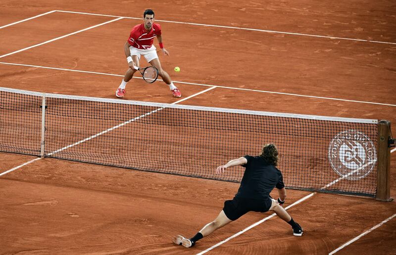 Novak Djokovic  in action against Stefanos Tsitsipas. EPA