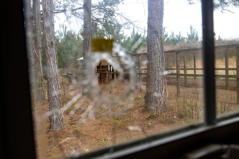 A bullet hole is seen from inside the feed room at the Murdaugh property. AP
