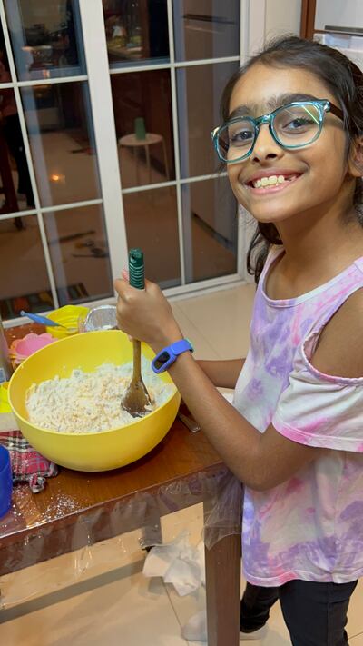 Anya Anand, 9, baking cookies to support earthquake survivors in Turkey and Syria. Photo: Cherry Pachisia