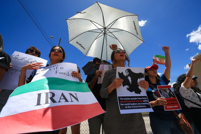 A demonstration against violence in Iran is held in Quito, Ecuador. The Iranian community in Ecuador protested outside the Iranian embassy. EPA