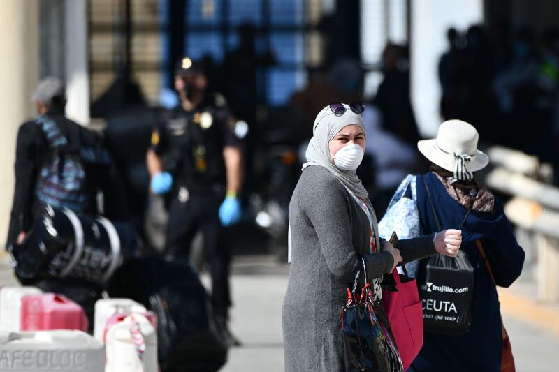 Moroccan citizens stranded in Spain due to coronavirus crisis, arrive at El Tarajal border crossing. AFP