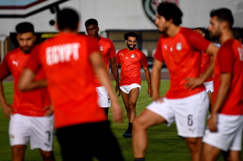 Salah laughs during a training session ahead of their opening match. AFP