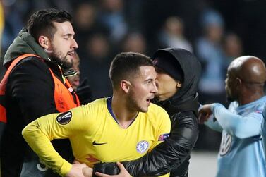 Eden Hazard, centre, is manhandled by a Malmo fan who wanted his shirt following Thursday's Europa League clash. Action Images via Reuters